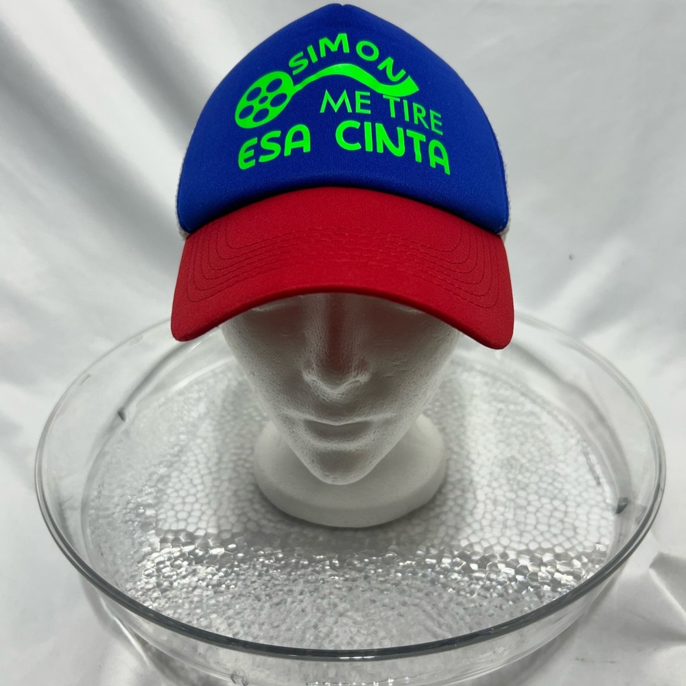 Blue and Red trucker Cap with neon Green Text.